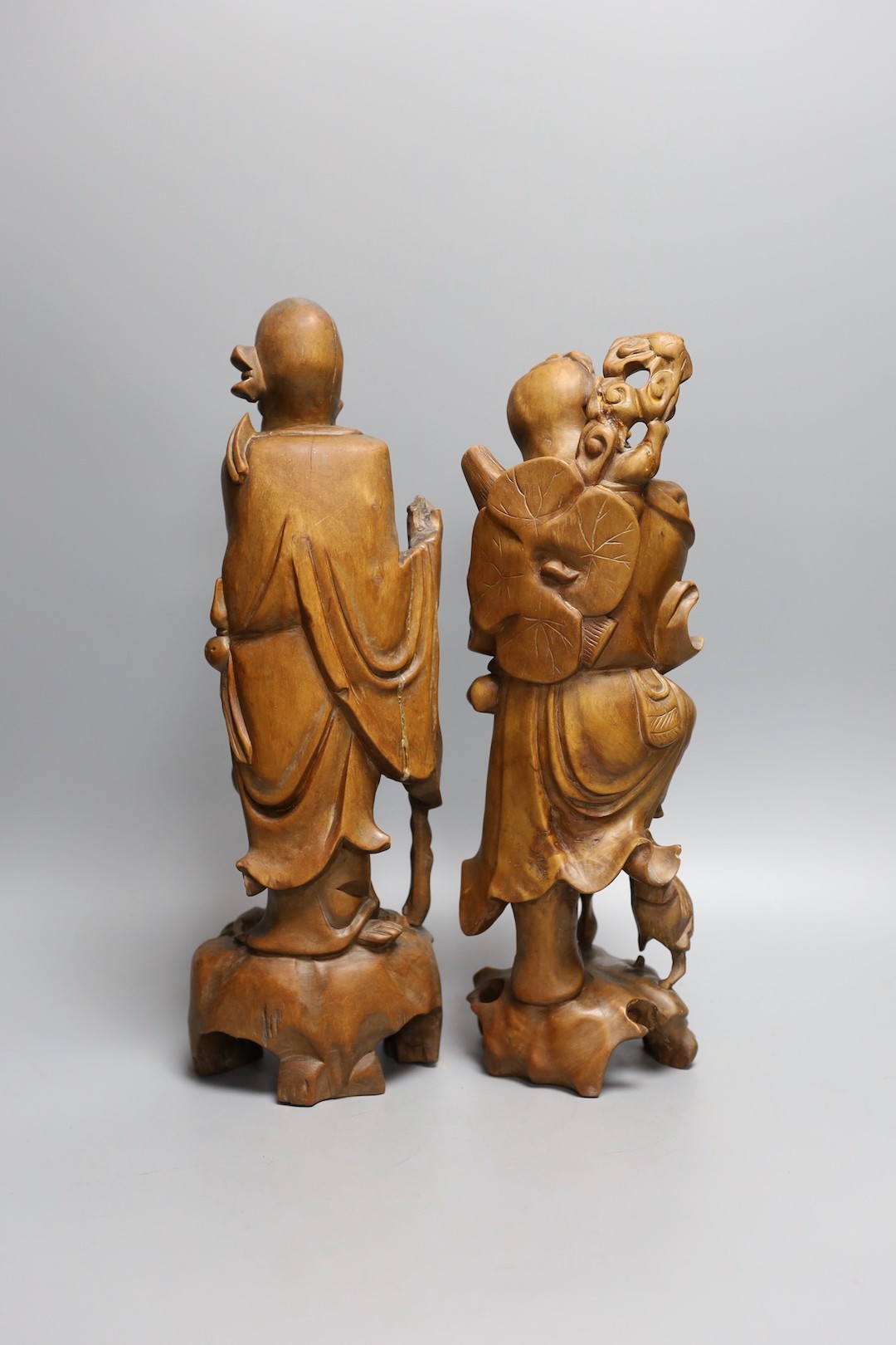 Two 19th century Chinese carved rootwood models of sages, 36cm